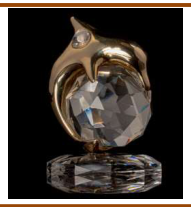 Golden dolphin with a crystal base